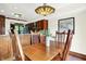 Inviting dining room featuring wood table, chairs, and a view into the kitchen at 6505 Miramar Ct, Indianapolis, IN 46250