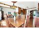 A beautiful dining room featuring hardwood floors, wood table and chairs, and a unique decorative chandelier at 6505 Miramar Ct, Indianapolis, IN 46250