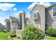 Exterior showcases the house and deck framed by well-maintained bushes and manicured green lawn at 6505 Miramar Ct, Indianapolis, IN 46250
