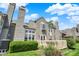 Exterior view showcasing a multi-story home, with a deck visible and well-maintained landscaping at 6505 Miramar Ct, Indianapolis, IN 46250