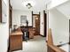 Upstairs home office with wooden desk, stylish lights, and natural light from windows at 6505 Miramar Ct, Indianapolis, IN 46250