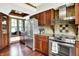 Well-appointed kitchen featuring stainless steel appliances, stone countertops, and hardwood cabinetry with breakfast nook at 6505 Miramar Ct, Indianapolis, IN 46250