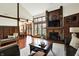 Spacious living room with hardwood floors, fireplace, and large windows offering natural light at 6505 Miramar Ct, Indianapolis, IN 46250