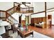Cozy living room with hardwood floors and staircase leading to a second-floor loft at 6505 Miramar Ct, Indianapolis, IN 46250
