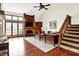 Spacious living room with hardwood floors, fireplace, and large windows offering natural light at 6505 Miramar Ct, Indianapolis, IN 46250