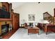 Spacious living room with hardwood floors, fireplace, and stairs leading to the loft at 6505 Miramar Ct, Indianapolis, IN 46250