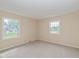 Bedroom featuring neutral walls, carpet, and natural light from the windows at 6530 Kingswood Dr, Indianapolis, IN 46256
