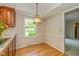 Breakfast nook with natural light and hardwood floors, located off kitchen at 6530 Kingswood Dr, Indianapolis, IN 46256