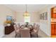 Staged dining room features elegant decor, light fixtures and plenty of natural light at 6530 Kingswood Dr, Indianapolis, IN 46256