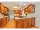 Spacious kitchen featuring wood cabinets, tile backsplash and a center island at 6530 Kingswood Dr, Indianapolis, IN 46256