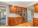 Kitchen with wood cabinets, stainless steel appliances, and hardwood flooring at 6530 Kingswood Dr, Indianapolis, IN 46256