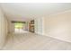 Spacious living room with fireplace, built-in shelves, and sliding doors to the outside deck at 6530 Kingswood Dr, Indianapolis, IN 46256