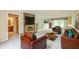 Staged living room with fireplace, neutral carpet and modern decor at 6530 Kingswood Dr, Indianapolis, IN 46256