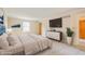 Staged main bedroom featuring large windows, neutral carpet and ensuite at 6530 Kingswood Dr, Indianapolis, IN 46256