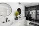 Modern bathroom with dual sinks, a black and white marble shower, and matte black fixtures at 6682 English Dr, Avon, IN 46123