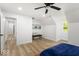 Spacious bedroom with a comfortable bench, wood floors, and neutral walls at 6682 English Dr, Avon, IN 46123