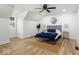 Cozy bedroom featuring a bed with blue bedding, stylish lamps, and wood floors at 6682 English Dr, Avon, IN 46123