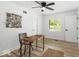 Bright bedroom featuring a wooden desk, chair, and neutral decor with a window view at 6682 English Dr, Avon, IN 46123