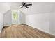 Spacious bedroom with wood floors, neutral walls, and a window view at 6682 English Dr, Avon, IN 46123