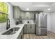 Modern kitchen features stainless appliances, white countertops and stylish fixtures at 6682 English Dr, Avon, IN 46123