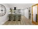 Stylish updated kitchen with modern appliances, breakfast bar and wood look floors at 6682 English Dr, Avon, IN 46123