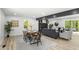 Inviting living room with stone fireplace, wood flooring, and sliding door to deck at 6682 English Dr, Avon, IN 46123
