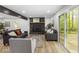 Cozy living room features a stone fireplace and sliding glass doors to the deck at 6682 English Dr, Avon, IN 46123