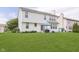 Well-maintained two-story home with a spacious backyard and a patio with seating area, perfect for outdoor entertaining at 6839 Powder Dr, Indianapolis, IN 46259