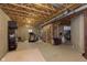 Spacious unfinished basement area for storage and exercise, featuring exposed ceiling at 6839 Powder Dr, Indianapolis, IN 46259