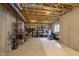 Unfinished basement with concrete floor and exposed ceiling, offering ample storage space at 6839 Powder Dr, Indianapolis, IN 46259