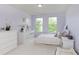 Calm and serene bedroom features a white dresser and ample natural light at 6839 Powder Dr, Indianapolis, IN 46259