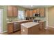 Eat-in kitchen with stainless steel appliances, kitchen island, and ample cabinet space at 6839 Powder Dr, Indianapolis, IN 46259