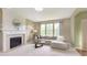 Cozy living room features a fireplace and a large window providing plenty of natural light at 6839 Powder Dr, Indianapolis, IN 46259