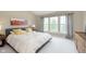 Well-lit main bedroom with a large window and neutral decor at 6839 Powder Dr, Indianapolis, IN 46259