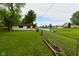 Scenic backyard with a charming view of the pond, blending natural beauty with a well-maintained lawn at 7228 Kimberly Ln, Plainfield, IN 46168