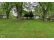 Spacious backyard with mature trees, providing a tranquil and picturesque setting for outdoor enjoyment at 7228 Kimberly Ln, Plainfield, IN 46168