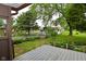 View of fenced backyard and detached garage from the outdoor patio at 7228 Kimberly Ln, Plainfield, IN 46168