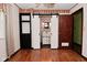 A bedroom showcasing wood floors, natural light, and an ensuite bathroom at 7228 Kimberly Ln, Plainfield, IN 46168