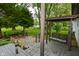 Inviting porch with swing and view of the spacious backyard, perfect for outdoor relaxation and enjoying the lush greenery at 7228 Kimberly Ln, Plainfield, IN 46168