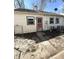 Exterior view of the back of the house, red door, and AC at 728 Lonsvale Dr, Anderson, IN 46013