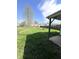 An expansive backyard featuring grass, a shed, and mature trees at 728 Lonsvale Dr, Anderson, IN 46013