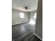 Cozy bedroom featuring modern vinyl floors and ample natural light from two large windows at 728 Lonsvale Dr, Anderson, IN 46013