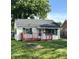 Charming single-story home featuring a red porch, well-maintained lawn, and inviting curb appeal at 728 Lonsvale Dr, Anderson, IN 46013