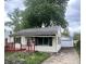 Charming single-Gathering home with quaint front porch and detached garage on a tree-lined street at 728 Lonsvale Dr, Anderson, IN 46013