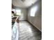 Functional kitchen featuring white appliances, laminate countertops, and abundant natural light at 728 Lonsvale Dr, Anderson, IN 46013
