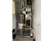 Water heater and furnace are on display in the utility closet at 728 Lonsvale Dr, Anderson, IN 46013
