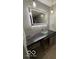 Modern bathroom featuring vanity with stone countertop and decorative sink at 7835 Caswell St, Indianapolis, IN 46259