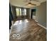 Bright bedroom featuring new wood floors and lots of natural light at 7835 Caswell St, Indianapolis, IN 46259