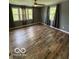 Bedroom featuring new wood floors and lots of natural light at 7835 Caswell St, Indianapolis, IN 46259