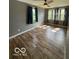 Bright bedroom featuring new wood floors and lots of natural light at 7835 Caswell St, Indianapolis, IN 46259
